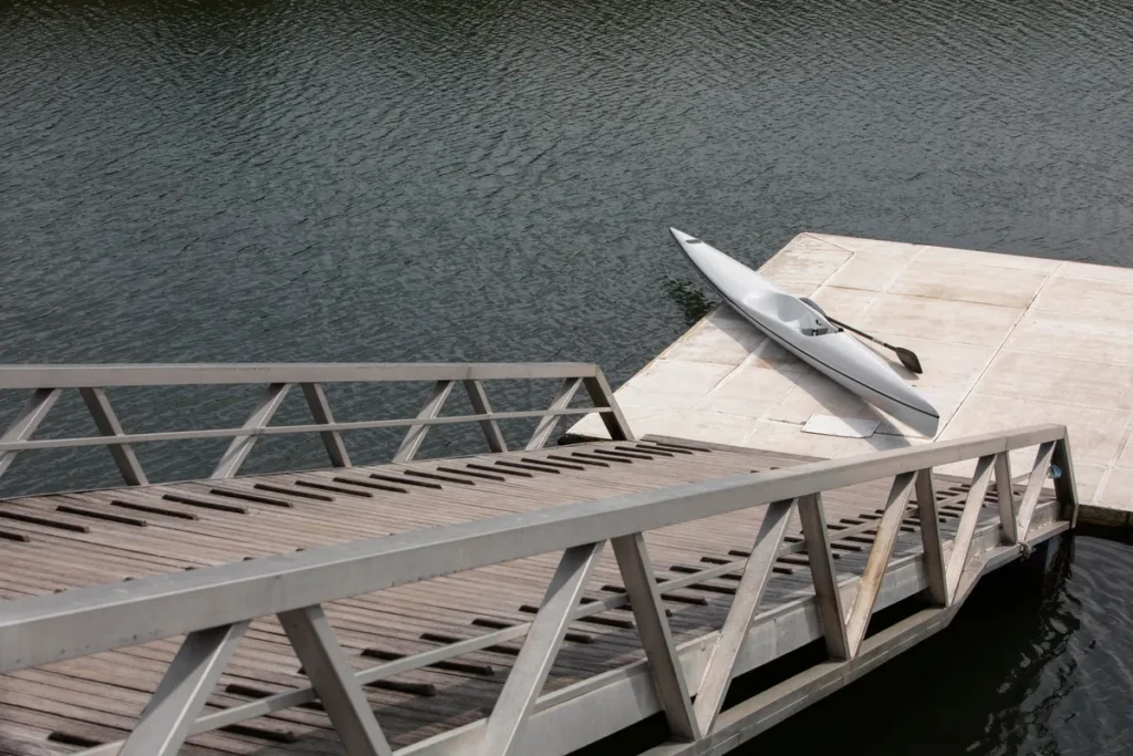 High angle view of a boat docked at a port, highlighting the importance of quality dock construction.